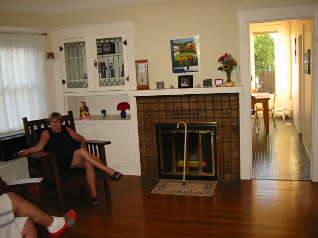 A nice little fireplace and built-in, right next to the kitchen.